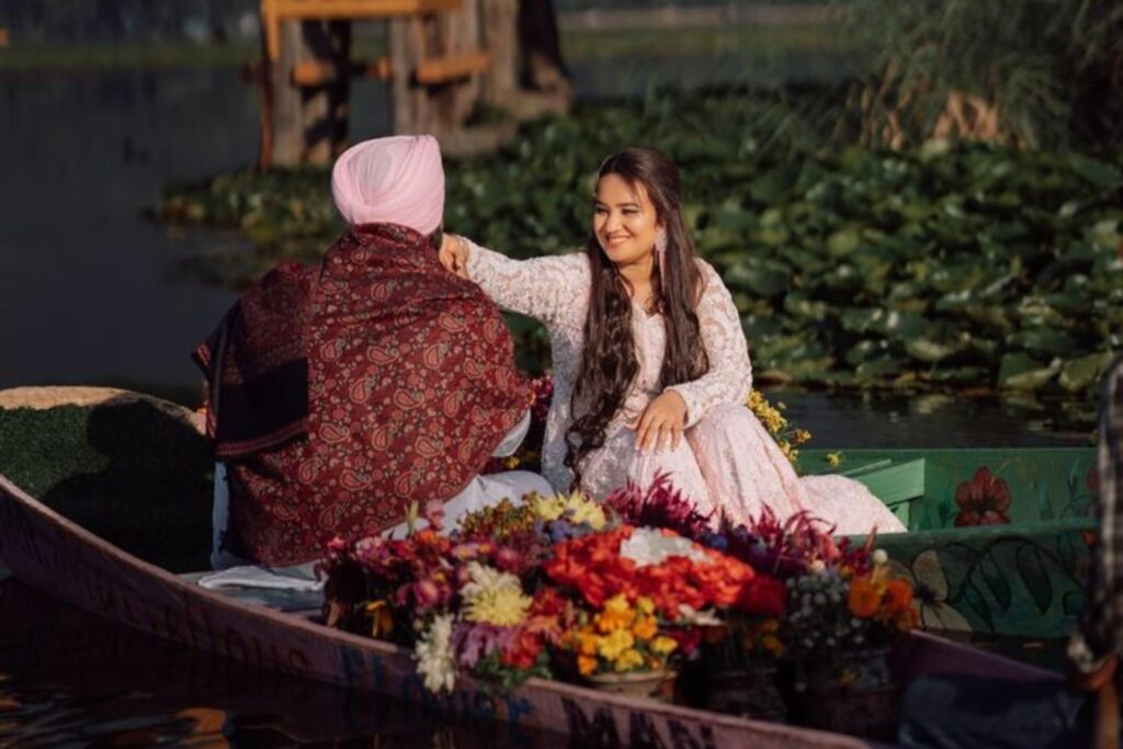 Pre wedding photoshoots in Kashmir on a shikara at Dal Lake with a romantic houseboat backdrop
