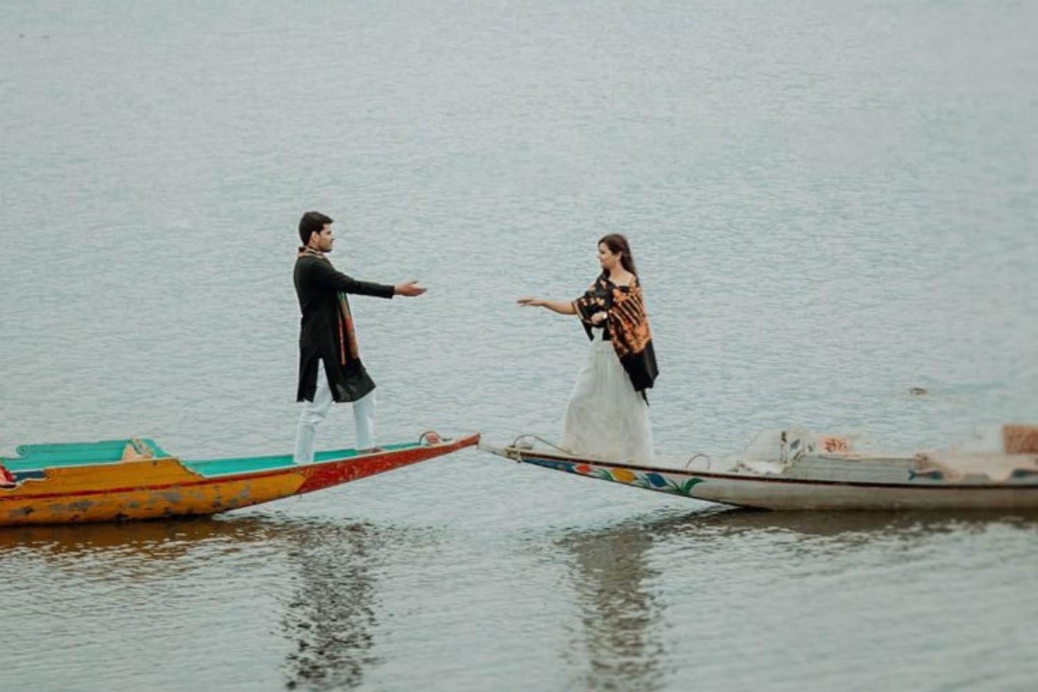 Romantic pre wedding photoshoot in Kashmir on Dal Lake with a couple on shikaras