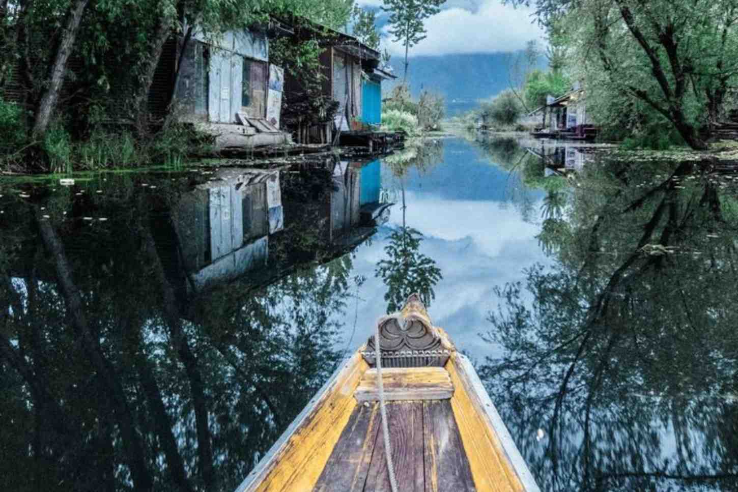 Traditional shikara ride experience in Kashmir near Srinagar houseboats